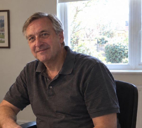 Lee at his desk at home